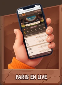 Main tenant un smartphone avec paris sportifs